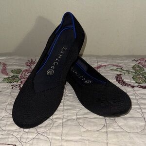 Rothy's Elegant Black Flats with Blue Highlights